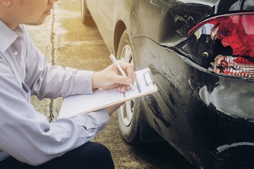 Car Accident Lawyer and Insurance Agent at work